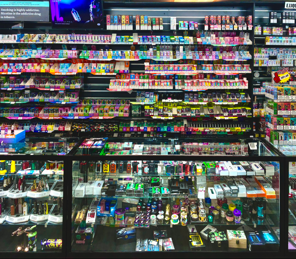 Disposable vapes and pod systems wall at Best Puff Tobacco